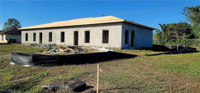 view of property exterior with a lawn