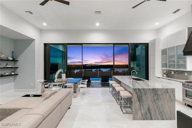 living room featuring recessed lighting, visible vents, and ceiling fan