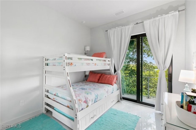 bedroom featuring access to exterior, visible vents, and baseboards