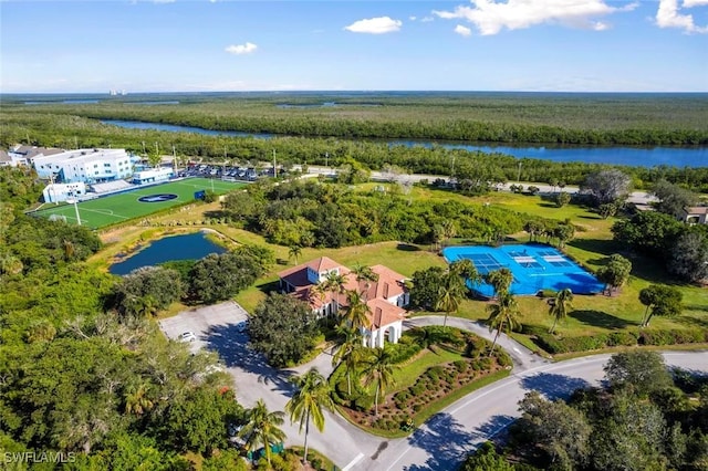 bird's eye view with a forest view and a water view