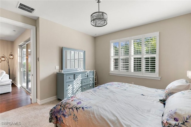 bedroom featuring access to outside and carpet