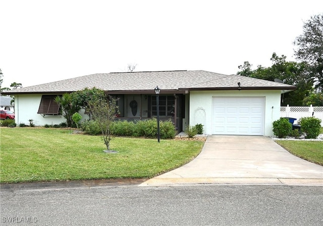 ranch-style home featuring a garage and a front yard