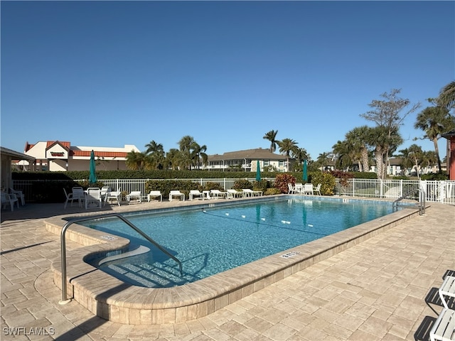 view of swimming pool featuring a patio