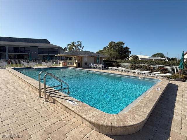 view of swimming pool featuring a patio area