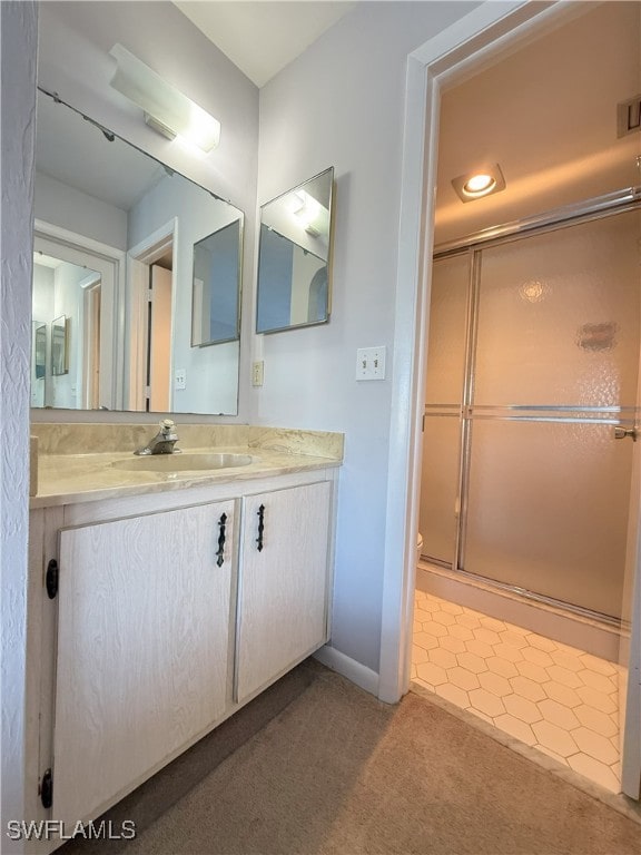 bathroom with vanity and walk in shower