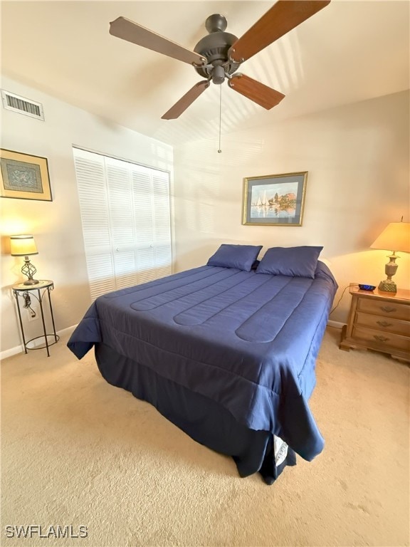 bedroom with light colored carpet and ceiling fan