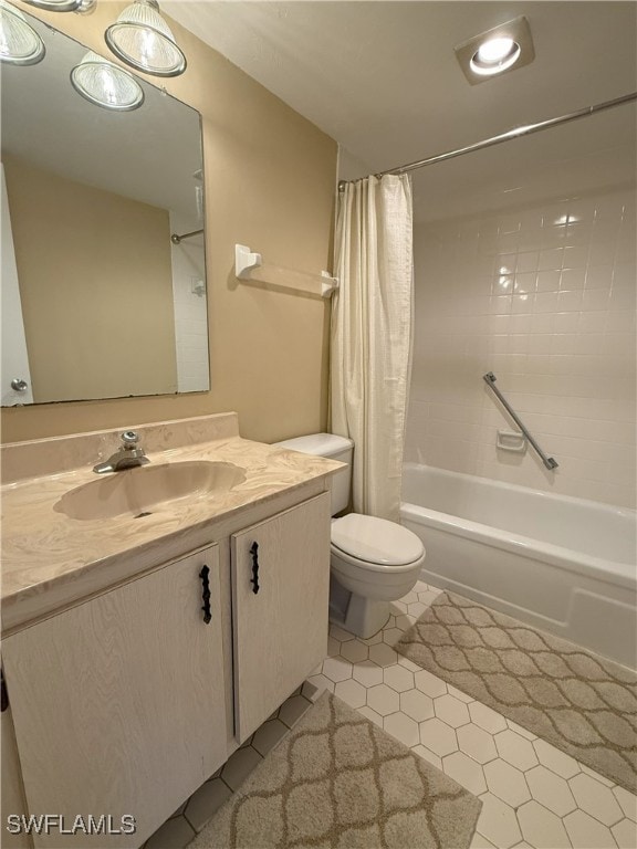 full bathroom with tile patterned floors, shower / bath combo, toilet, and vanity