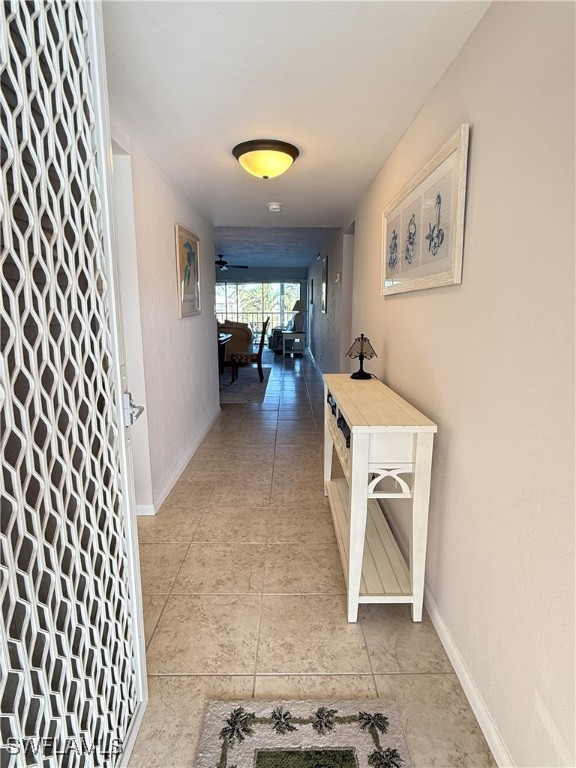 corridor with light tile patterned floors