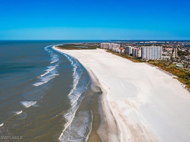 aerial view featuring a water view and a view of the beach