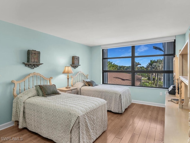 bedroom with hardwood / wood-style flooring