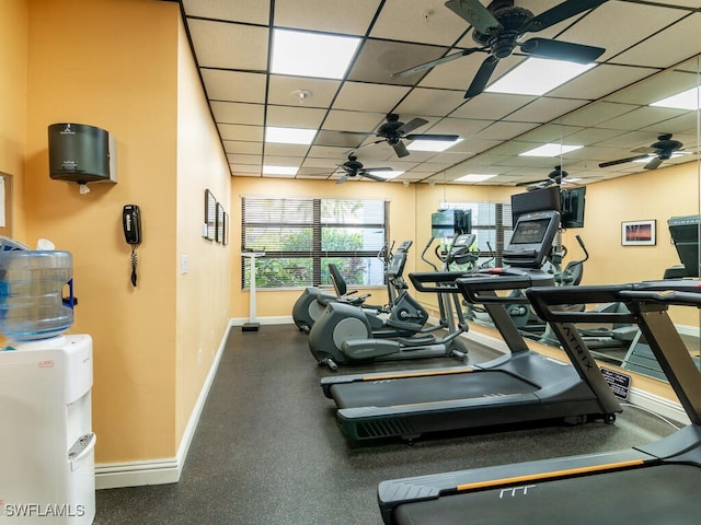 workout area with a paneled ceiling