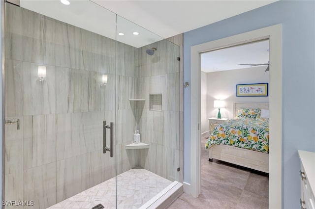 bathroom featuring tile patterned flooring, ceiling fan, and tiled shower