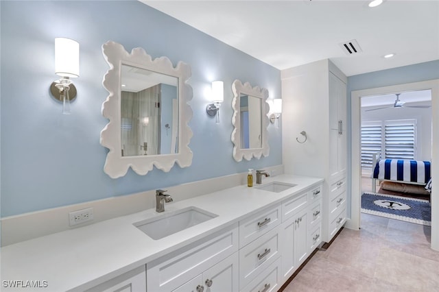 bathroom with tile patterned floors and vanity