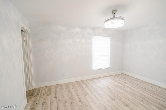 spare room featuring light hardwood / wood-style floors