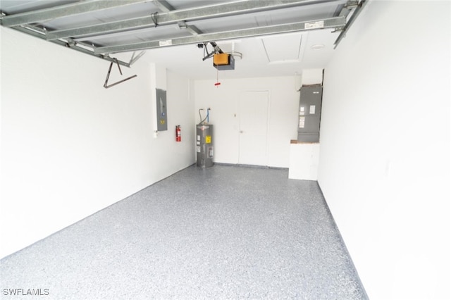 garage featuring electric panel, water heater, and a garage door opener