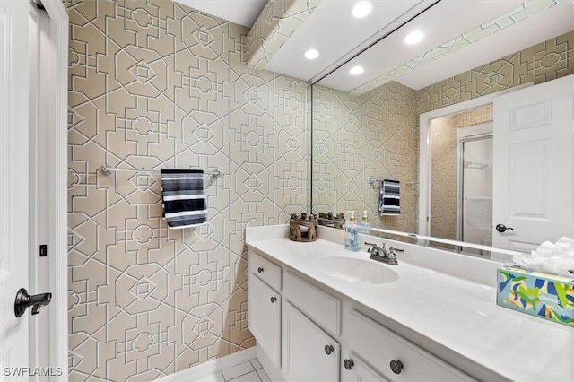 bathroom with tile patterned floors and vanity