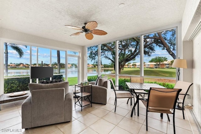 sunroom featuring ceiling fan