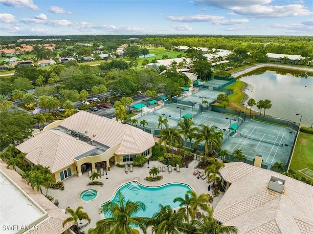 birds eye view of property with a water view