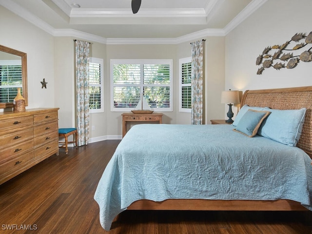 bedroom with ornamental molding, ceiling fan, and dark wood-type flooring