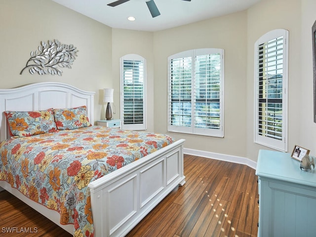 bedroom with ceiling fan and dark wood-type flooring