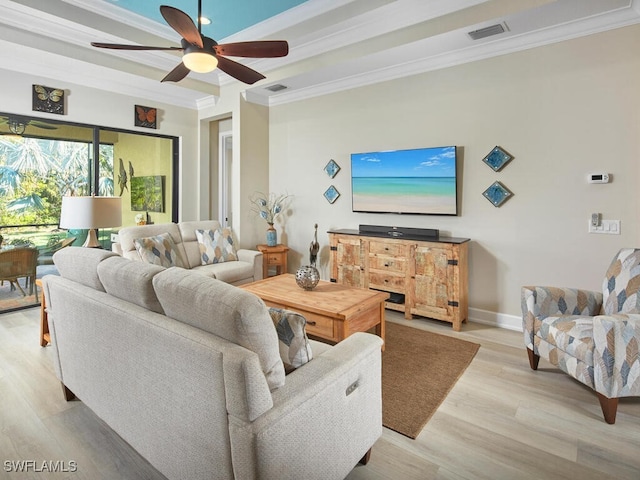 living room featuring light hardwood / wood-style floors, ceiling fan, and ornamental molding