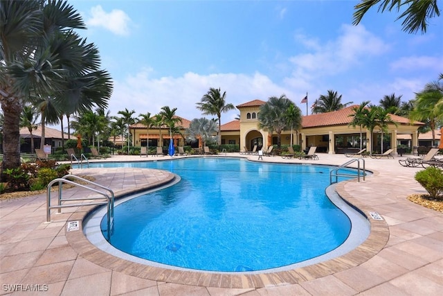 view of swimming pool with a patio