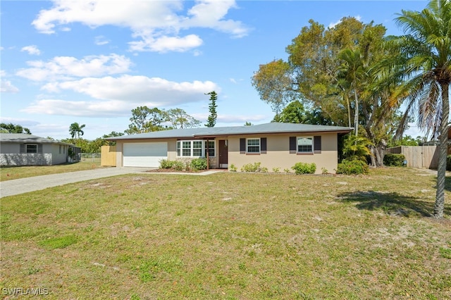 single story home featuring a front yard and a garage