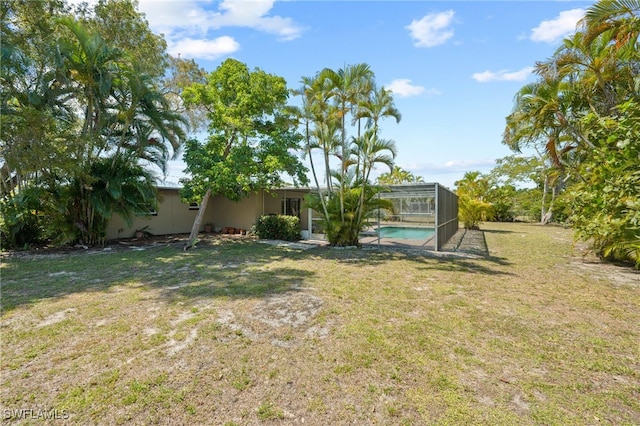 view of yard featuring a lanai