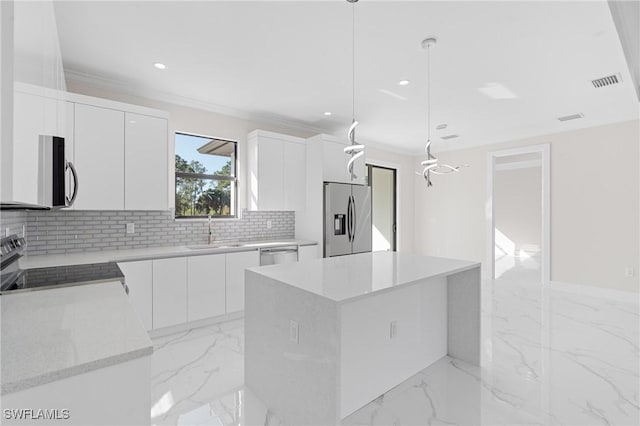 kitchen with white cabinetry, stainless steel appliances, a center island, and hanging light fixtures