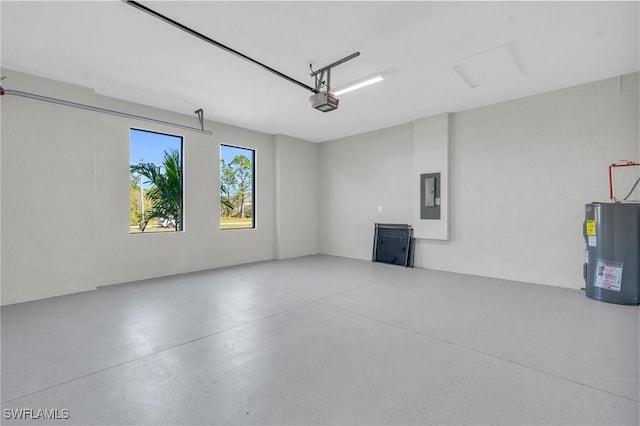 garage featuring electric panel, a garage door opener, and electric water heater