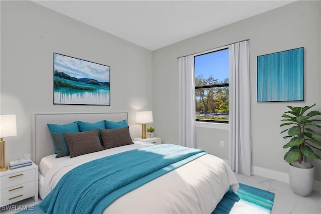 bedroom with marble finish floor and baseboards