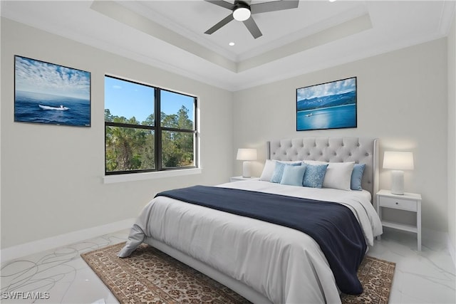 bedroom with a ceiling fan, baseboards, marble finish floor, ornamental molding, and a tray ceiling