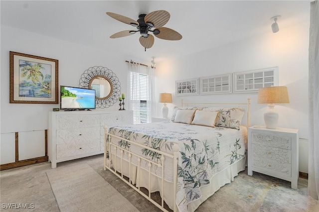 bedroom featuring ceiling fan and concrete flooring