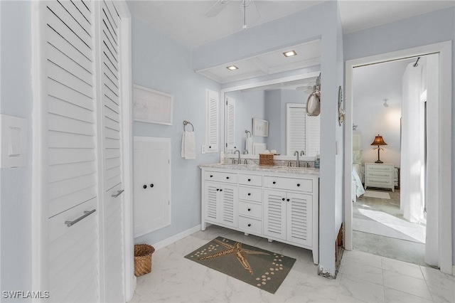 bathroom featuring vanity and ceiling fan