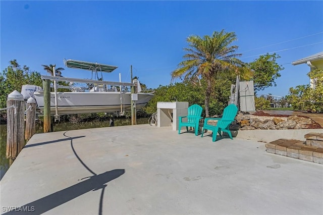 view of patio with a boat dock