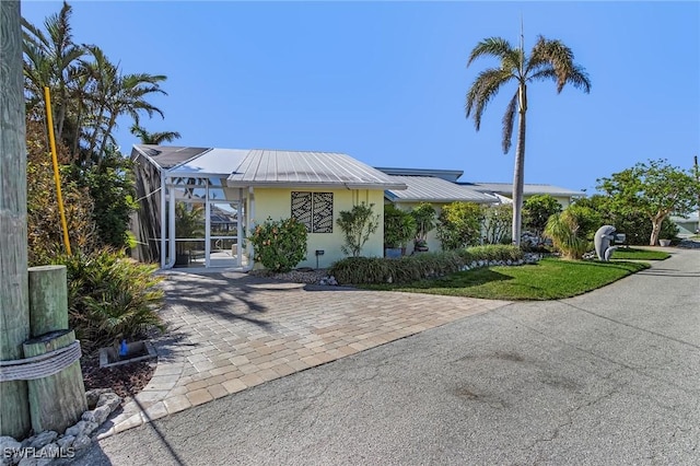 view of front of house featuring a lanai