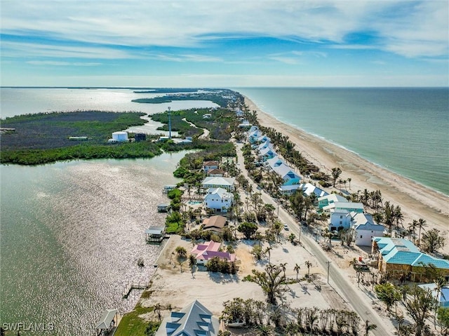 bird's eye view with a view of the beach and a water view