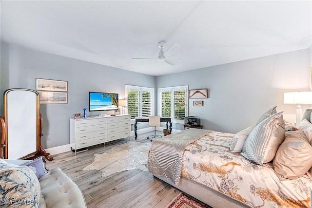 bedroom with light wood-type flooring and ceiling fan