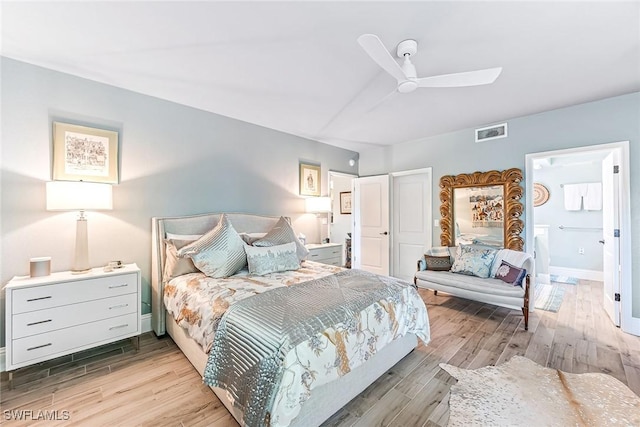 bedroom with ensuite bathroom, ceiling fan, and light wood-type flooring