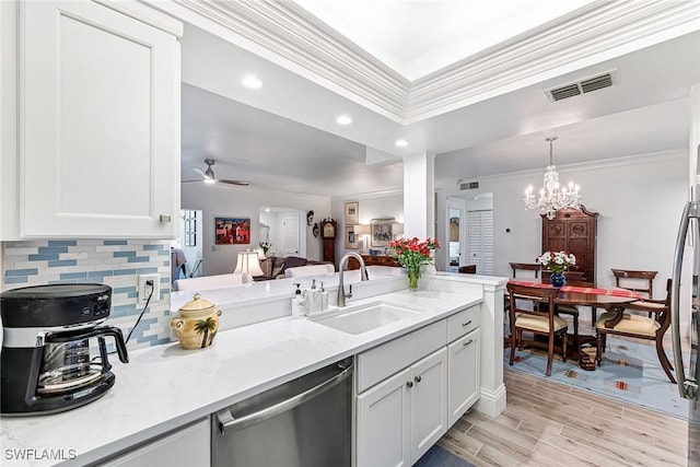 kitchen featuring white cabinetry, sink, light stone counters, and dishwasher