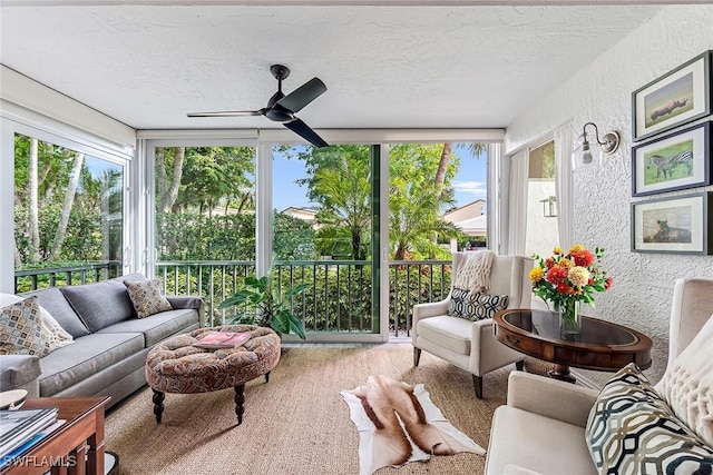 sunroom / solarium featuring ceiling fan