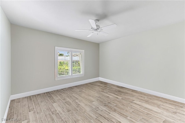 788 Willowbrook Dr Unit 502, Naples, FL 34108 - spare room featuring light wood-style floors, a ceiling fan, and baseboards