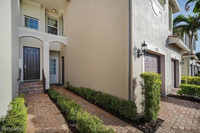 doorway to property featuring a garage