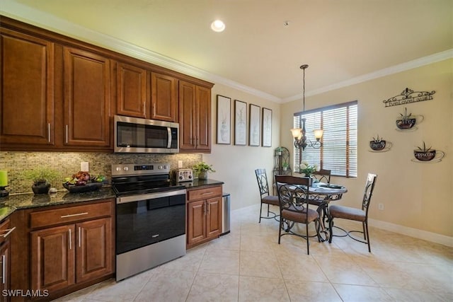 6502 Monterey Pt Unit 202, Naples, FL 34105 - kitchen with appliances with stainless steel finishes, backsplash, a chandelier, crown molding, and pendant lighting