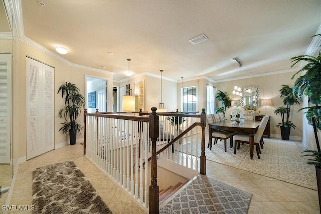 6502 Monterey Pt Unit 202, Naples, FL 34105 - hall featuring crown molding, a chandelier, and an upstairs landing