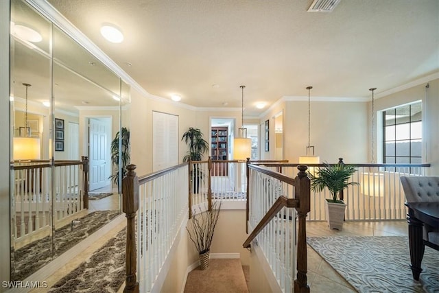 6502 Monterey Pt Unit 202, Naples, FL 34105 - hall with an upstairs landing, crown molding, and tile patterned floors