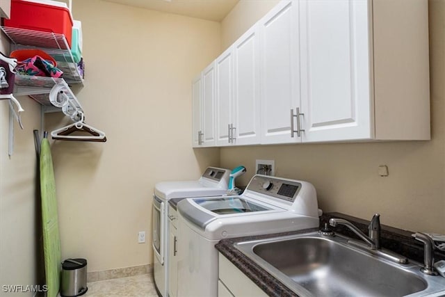 6502 Monterey Pt Unit 202, Naples, FL 34105 - laundry room with washing machine and clothes dryer, cabinet space, and tile patterned flooring