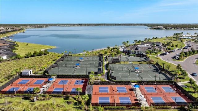 birds eye view of property with a water view