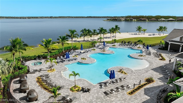 view of swimming pool with a water view