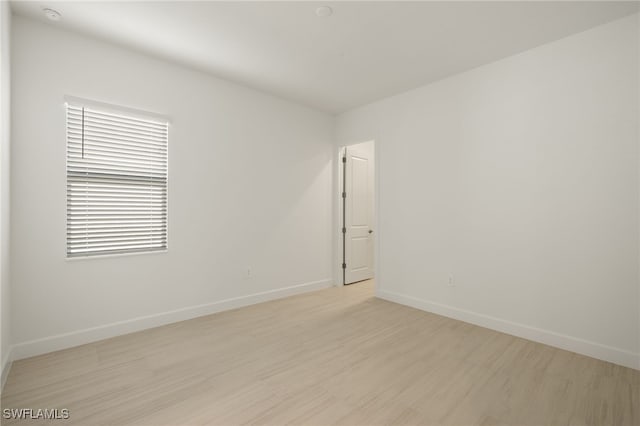 empty room with light wood-type flooring